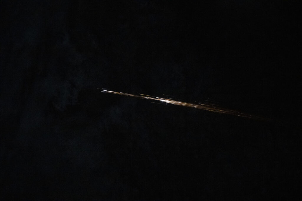 From The ISS, Chris Williams Captured A Fireball Breaking Apart Over West Africa