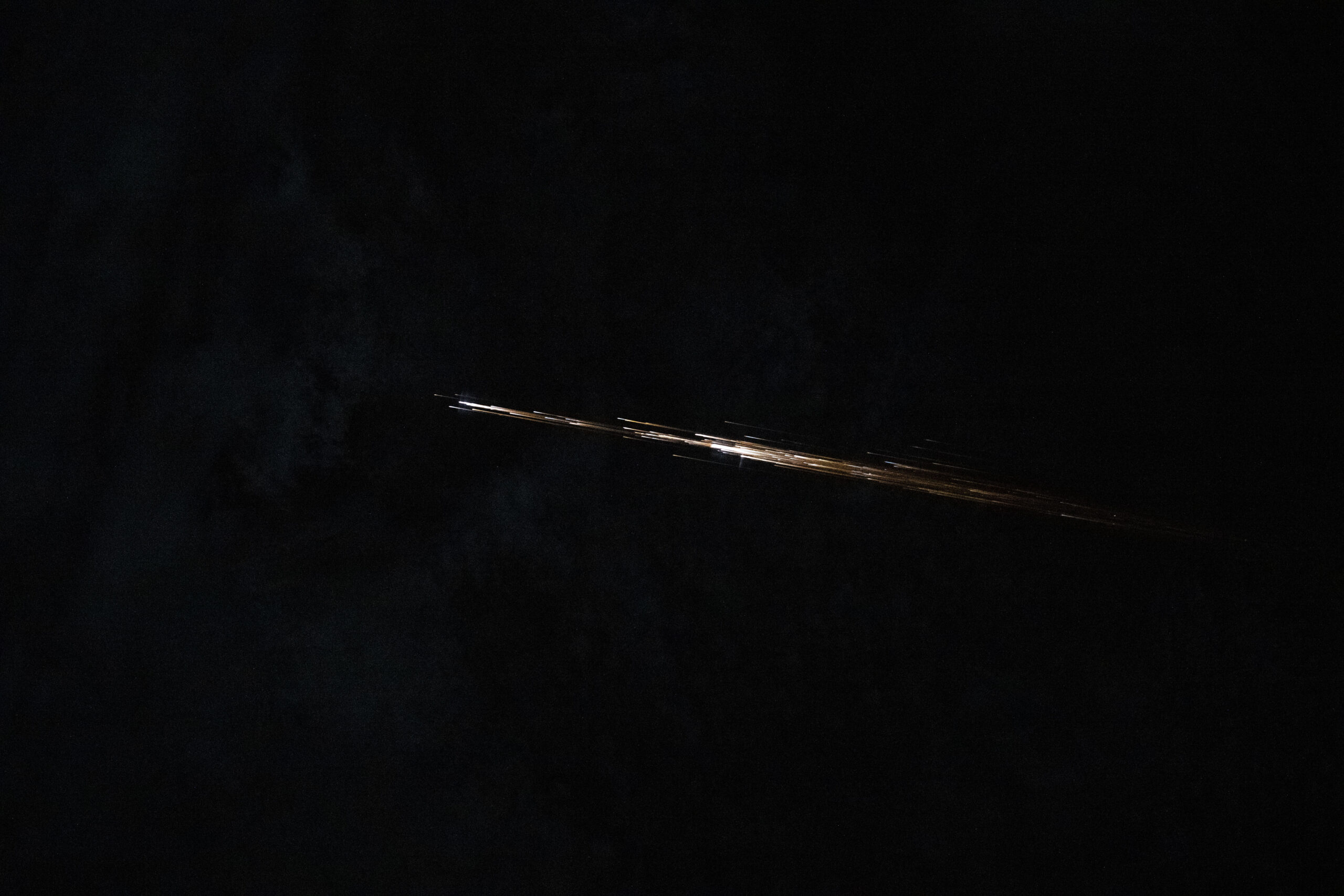 From The ISS, Chris Williams Captured A Fireball Breaking Apart Over West Africa