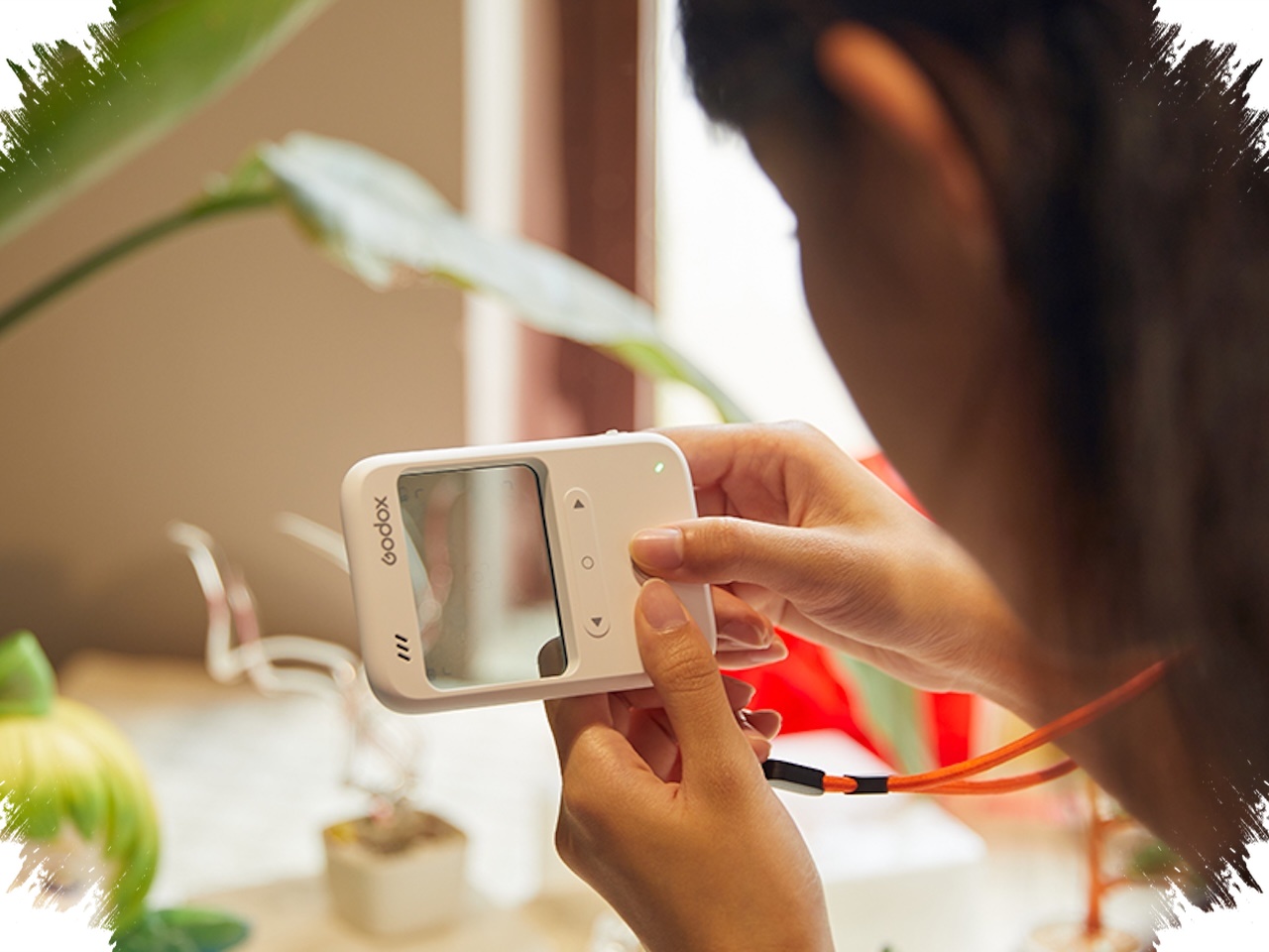 Godox C100 Looks Like an iPod, but Its Transparent Display Reveals a Strange Extra Trick